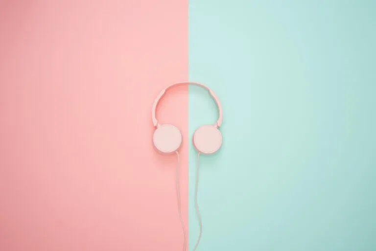 Pink and green noise cancelling headset by icons8: unsplash.com