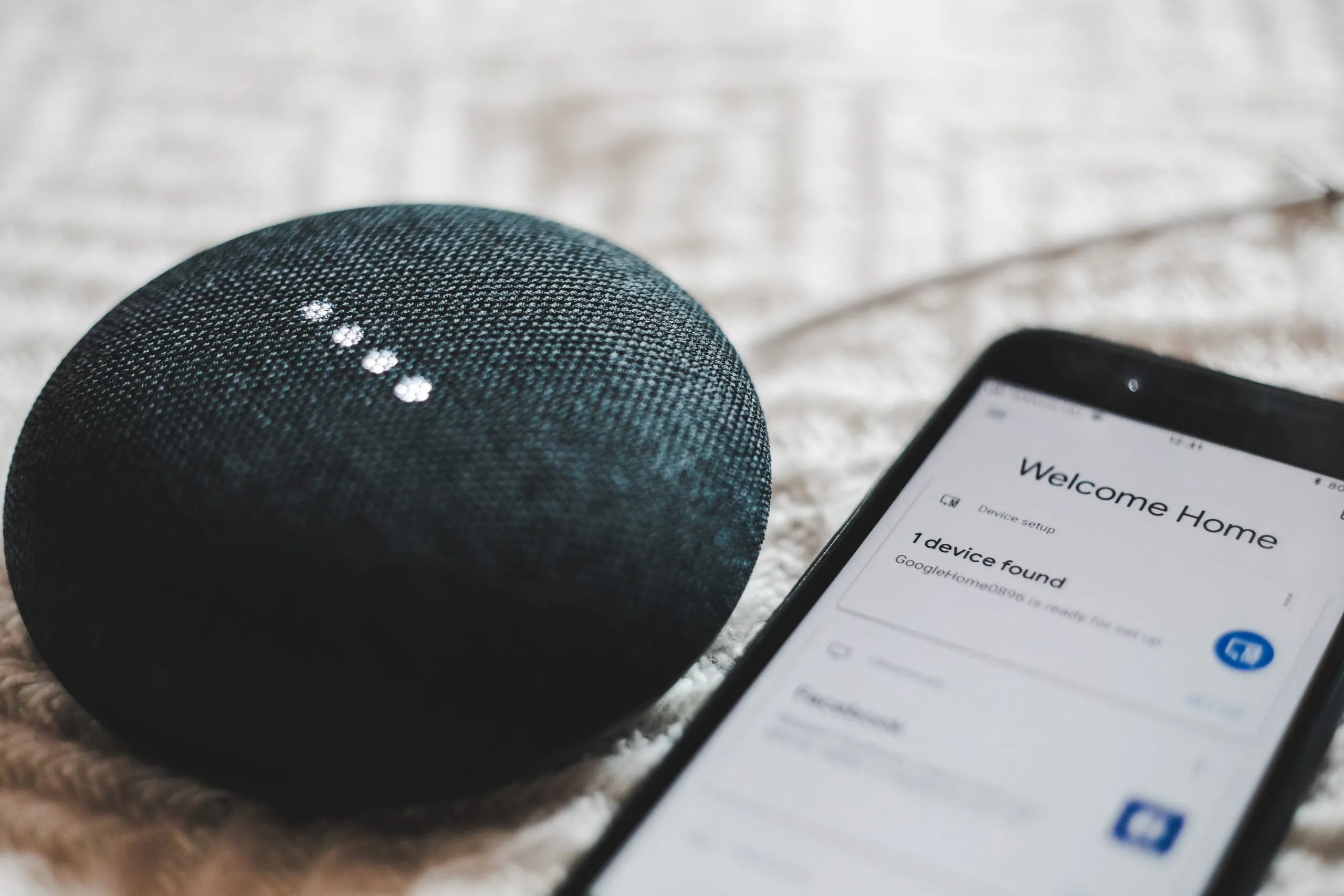 smart speakers google nest mini connected to a mobile phone
