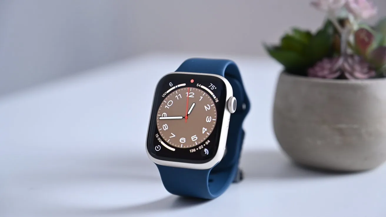 apple watch series 8 with a blue band on a white table
